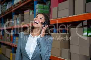 Business woman calling with her headset