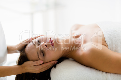 Beautiful woman receiving massage from masseur