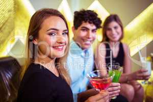 Portrait of joyful friends in nightclub