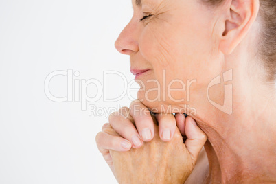 Cropped image of mature woman praying
