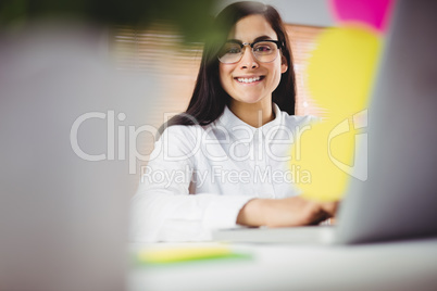 Portrait of smiling woman working in office
