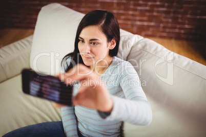 Beautiful woman taking selfie