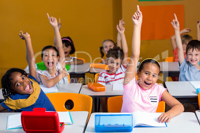 Children raising their hands