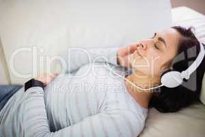 High angle view of woman listening to music