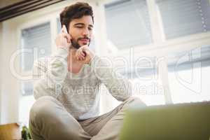 Businessman using mobile phone in office