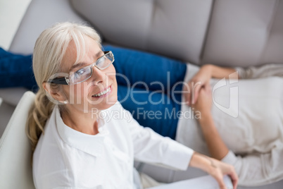 Portrait of smiling therapist by woman