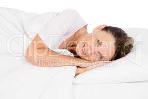 Portrait of smiling mature woman lying on bed