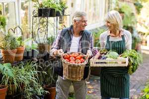 Couple carrying fresh vegetables