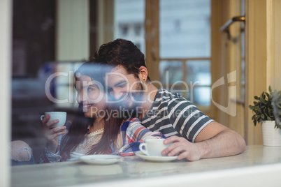 Happy couple bonding at cafe