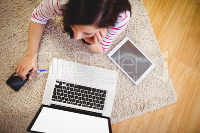 High angle view of woman with laptop and digital tablet
