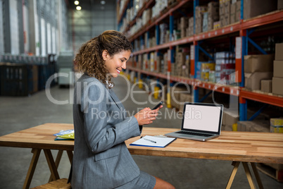 Business woman using her phone
