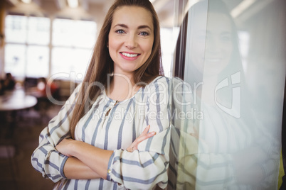 Portrait of smiling businesswoman in office cafeteria