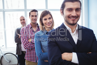 Smiling business people standing in row