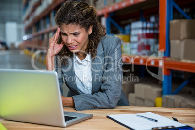 Business woman is stressed because of work