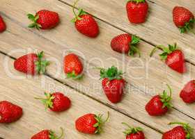 strawberries on a wooden surface background