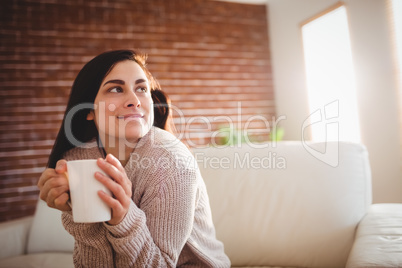 Young woman looking away at home