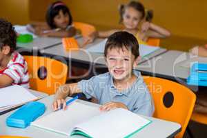 Cute boy with book on bench