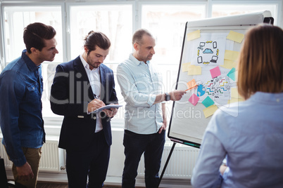 Businessman with coworkers discussing in meeting room