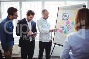 Businessman with coworkers discussing in meeting room