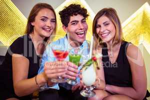 Portrait of happy friends in nightclub