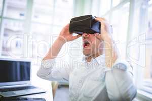 Male graphic designer using virtual reality headset