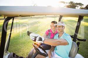Smiling golfer couple taking selfie