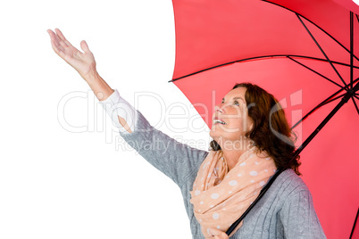 Mature woman holding umbrella