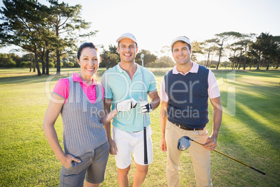 Portrait of smiling golfer friends