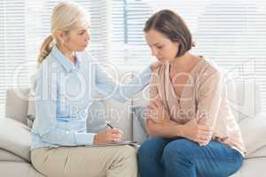 Therapist talking to patient