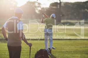 Golfer men standing on field