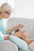 Woman receiving acupuncture treatment
