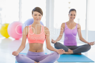 Smiling women exercising