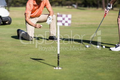 Cropped image of woman playing golf