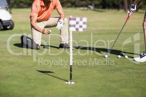 Cropped image of woman playing golf