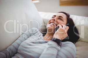 Smiling woman talking on phone