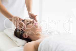 Masseur massaging woman