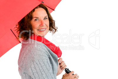 Portrait of smiling mature woman holding umbrella