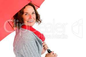 Portrait of smiling mature woman holding umbrella