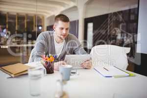 Businessman working using digital tablet in creative office