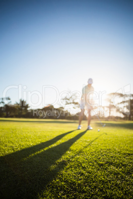 Full length of man playing golf on field