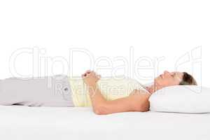 Mature woman sleeping on bed