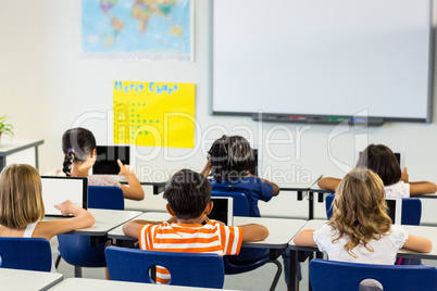 Children using digital tablets