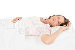 Mature woman relaxing on bed