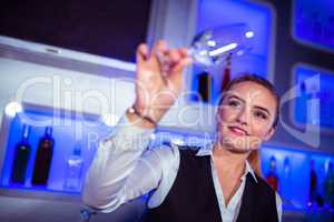 Barmaid holding glass