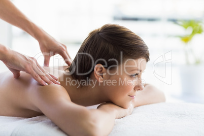 Relaxed woman enjoying back massage