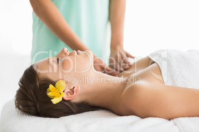 Relaxed woman receiving massage