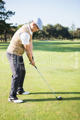 Golfer preparing his shot