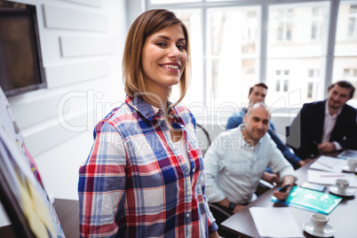 Cheerful businesswoman giving presentation