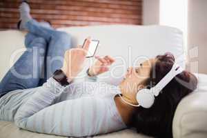Woman listening to music at home