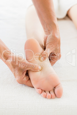 Cropped image of woman receiving foot massage